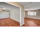 Open-concept living area featuring hardwood floors, natural light, and neutral paint, ready for your design touches at 3753 S Rosecrest Cir, Las Vegas, NV 89121