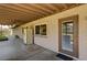 Covered patio with neutral paint, a ceiling fan, outdoor storage, and a door leading to the interior at 3753 S Rosecrest Cir, Las Vegas, NV 89121
