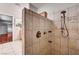 Large tiled shower with bronze fixtures at 3753 S Rosecrest Cir, Las Vegas, NV 89121