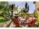 Relaxing backyard with lush landscaping, a hot tub, and outdoor seating area for entertaining at 4017 Kristina Lynn Ave, North Las Vegas, NV 89081
