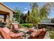 Beautiful backyard with a spa, lush green lawn, BBQ, and cozy patio furniture at 4017 Kristina Lynn Ave, North Las Vegas, NV 89081