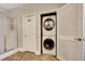 Bathroom featuring a stacked washer/dryer, shower and tile flooring at 4017 Kristina Lynn Ave, North Las Vegas, NV 89081