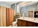 Bathroom featuring dual sinks, wood cabinets, and shower at 4017 Kristina Lynn Ave, North Las Vegas, NV 89081