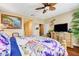 Bedroom showcasing bright floral bedding, accent furniture and fixtures with neutral tones at 4017 Kristina Lynn Ave, North Las Vegas, NV 89081