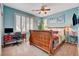 Inviting bedroom boasts a desk, ceiling fan, and bright, natural light at 4017 Kristina Lynn Ave, North Las Vegas, NV 89081