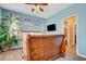 This bedroom boasts a wooden bed frame, a ceiling fan, and cool blue walls at 4017 Kristina Lynn Ave, North Las Vegas, NV 89081