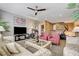 Comfortable bonus room features plush seating, ceiling fan, and natural light at 4017 Kristina Lynn Ave, North Las Vegas, NV 89081