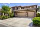 Two-story home featuring a three car garage and neutral color palette at 4017 Kristina Lynn Ave, North Las Vegas, NV 89081