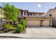 Two-story home with a three car garage, desert landscaping, and a beautiful tiled roof at 4017 Kristina Lynn Ave, North Las Vegas, NV 89081