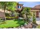 Charming home with manicured front lawn, lovely trees, and desert landscaping at 4017 Kristina Lynn Ave, North Las Vegas, NV 89081
