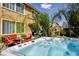 Beautiful backyard featuring a well-maintained hot tub, with patio, landscaping and seating at 4017 Kristina Lynn Ave, North Las Vegas, NV 89081