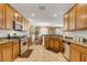 Well-lit kitchen featuring granite countertops, stainless steel appliances, and ample wood cabinetry at 4017 Kristina Lynn Ave, North Las Vegas, NV 89081