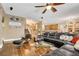 Spacious living room with modern decor, hardwood floors, and a comfortable black leather sectional at 4017 Kristina Lynn Ave, North Las Vegas, NV 89081