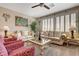 Neutral living room showcasing shuttered windows, sofa set and a ceiling fan at 4017 Kristina Lynn Ave, North Las Vegas, NV 89081