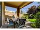 Inviting covered patio with a dining table and chairs, perfect for outdoor meals and relaxing at 4017 Kristina Lynn Ave, North Las Vegas, NV 89081