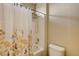 This bright shower and bathtub combo has neutral-toned walls and a shower curtain at 4017 Kristina Lynn Ave, North Las Vegas, NV 89081