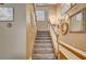 Carpeted staircase leading to the second floor, decorated with mirrors and neutral tones at 4017 Kristina Lynn Ave, North Las Vegas, NV 89081