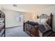 Comfortable bedroom with a large bed, neutral colors, and plenty of natural light at 489 Filaree Pl, Henderson, NV 89015
