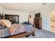 Cozy bedroom with carpet flooring and ample space for a dresser and storage at 489 Filaree Pl, Henderson, NV 89015