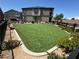Beautiful community space with a lawn, benches, flowers and a fenced border at 489 Filaree Pl, Henderson, NV 89015