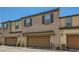 Townhome boasts charming architectural details, including a well-maintained stucco exterior and a private garage at 489 Filaree Pl, Henderson, NV 89015