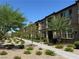 Attractive townhome exterior, landscaped walkway, fostering a welcoming and well-maintained community ambiance at 489 Filaree Pl, Henderson, NV 89015