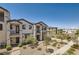 Beautiful townhome featuring a desert landscape, walkways, and a community park at 489 Filaree Pl, Henderson, NV 89015