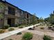Charming townhome exterior with manicured landscaping, enhancing curb appeal and inviting ambiance at 489 Filaree Pl, Henderson, NV 89015