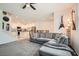 Inviting living room with comfortable seating, modern decor, and an open floor plan to the kitchen at 489 Filaree Pl, Henderson, NV 89015