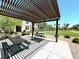 Community picnic area with shaded tables, lush landscaping, offering residents a perfect spot for outdoor dining at 489 Filaree Pl, Henderson, NV 89015