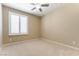 Cozy bedroom featuring a ceiling fan and shuttered windows for controlled natural light and privacy at 5005 Chambliss Dr, Las Vegas, NV 89130