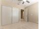 A bedroom features a sliding door closet and an open door leading to an adjacent room at 5005 Chambliss Dr, Las Vegas, NV 89130