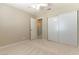 Bedroom featuring sliding closet doors, ceiling fan, and an open doorway to an adjoining room at 5005 Chambliss Dr, Las Vegas, NV 89130
