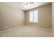 Simple bedroom with a ceiling fan and a window fitted with white shutters for light control at 5005 Chambliss Dr, Las Vegas, NV 89130