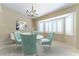 Dining room features a bay window and a modern chandelier, perfect for gatherings at 5005 Chambliss Dr, Las Vegas, NV 89130