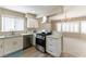 Updated kitchen with stainless steel appliances, granite countertops, open to the living area at 5005 Chambliss Dr, Las Vegas, NV 89130