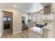 Modern kitchen with stainless steel appliances, granite countertops, and wood-style flooring at 5005 Chambliss Dr, Las Vegas, NV 89130