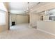 Spacious living room adjacent to the modern kitchen with light-filled space at 5005 Chambliss Dr, Las Vegas, NV 89130