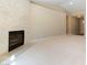 Inviting living room with brick fireplace, neutral carpet and light-filled space at 5005 Chambliss Dr, Las Vegas, NV 89130