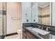 Bathroom features sink with granite counters and tiled shower at 5367 Secluded Brook Ct, Las Vegas, NV 89149