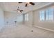 Large bedroom with recessed ceiling and windows at 5367 Secluded Brook Ct, Las Vegas, NV 89149