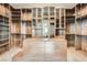 Custom closet with wood cabinetry, drawers, shelving and hanging storage at 5367 Secluded Brook Ct, Las Vegas, NV 89149
