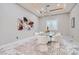 Modern dining room with elegant chandelier, contemporary artwork, and comfortable seating at 5367 Secluded Brook Ct, Las Vegas, NV 89149