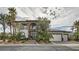 Beautiful two-story home with stone accents, manicured landscaping, palm trees, and a three-car garage at 5367 Secluded Brook Ct, Las Vegas, NV 89149