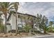 Stunning two-story home with stone accents, balcony, manicured landscaping, and a circular window at 5367 Secluded Brook Ct, Las Vegas, NV 89149