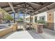 Outdoor kitchen with stainless steel appliances, bar seating, and shower, perfect for entertaining at 5367 Secluded Brook Ct, Las Vegas, NV 89149