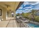 Relax and enjoy the views from the covered patio with ceiling fans and outdoor seating at 5367 Secluded Brook Ct, Las Vegas, NV 89149