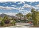 Charming neighborhood street view with lush landscaping, mature trees, and mountain views at 5367 Secluded Brook Ct, Las Vegas, NV 89149
