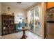 Eat in kitchen featuring stainless steel appliances, wooden cabinetry and backyard access at 6623 Brick House Ave, Las Vegas, NV 89122