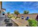Newly landscaped backyard with patio, block wall, desert landscaping and seating area at 6830 Compass St, North Las Vegas, NV 89084